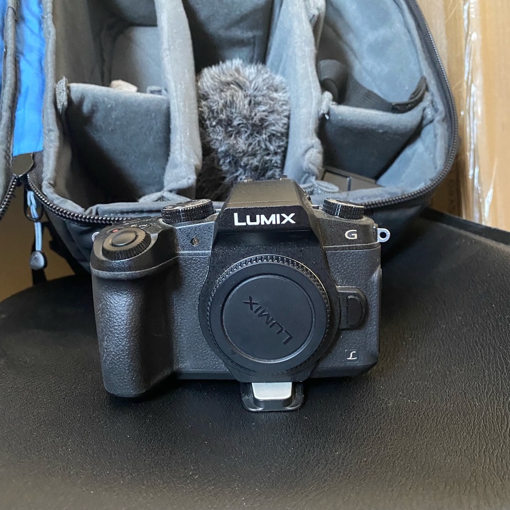 Lumix G85 camera, w/ rode mic, Joby tripod, & backpack carrying case.
